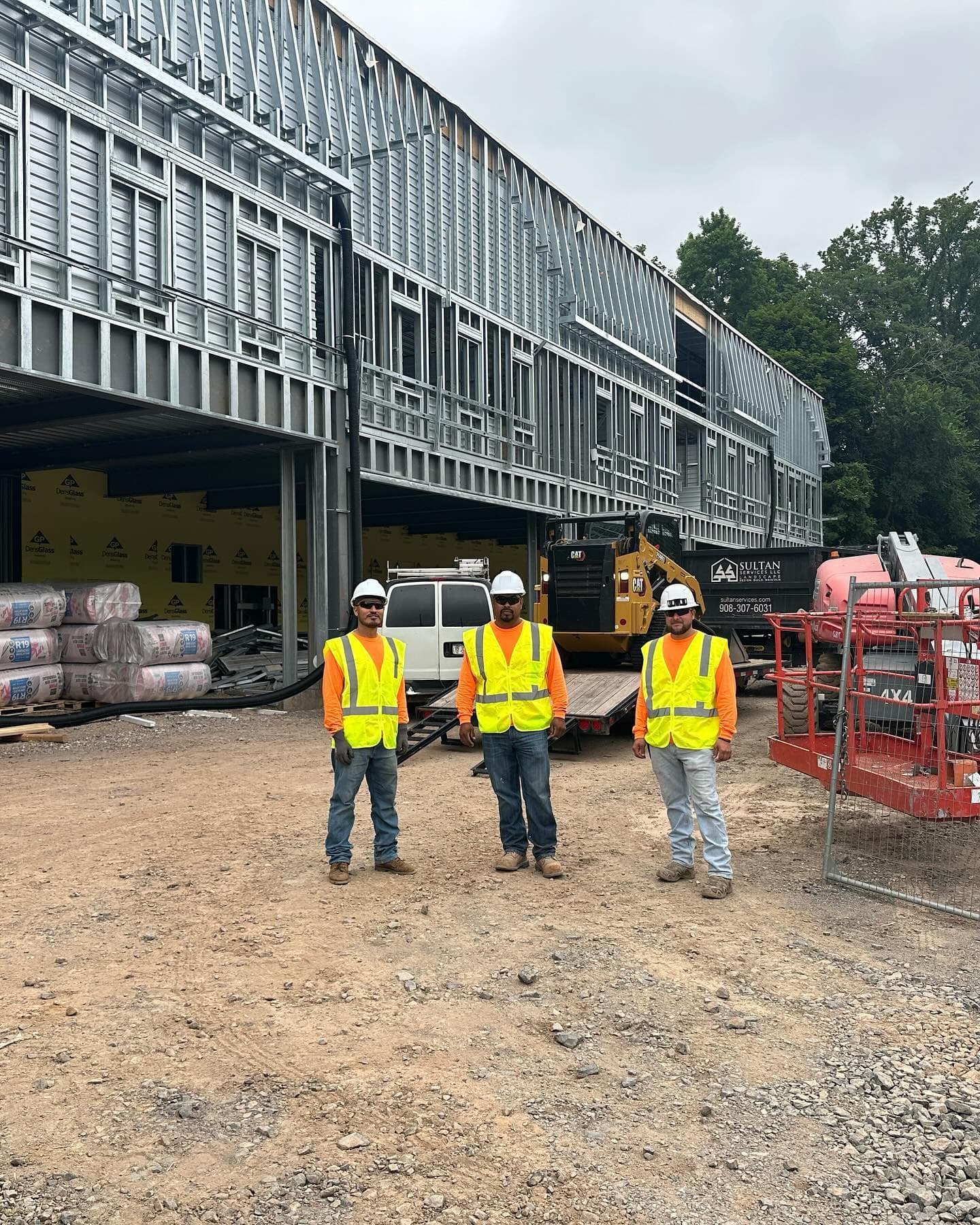 Sultan Services crew at construction site with equipment