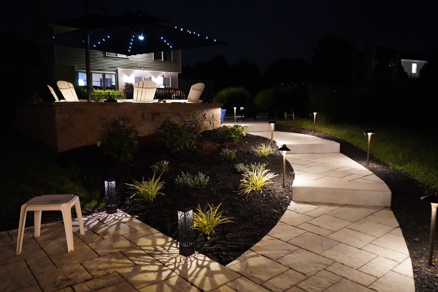 A multi level patio and walkway built to use the full backyard.