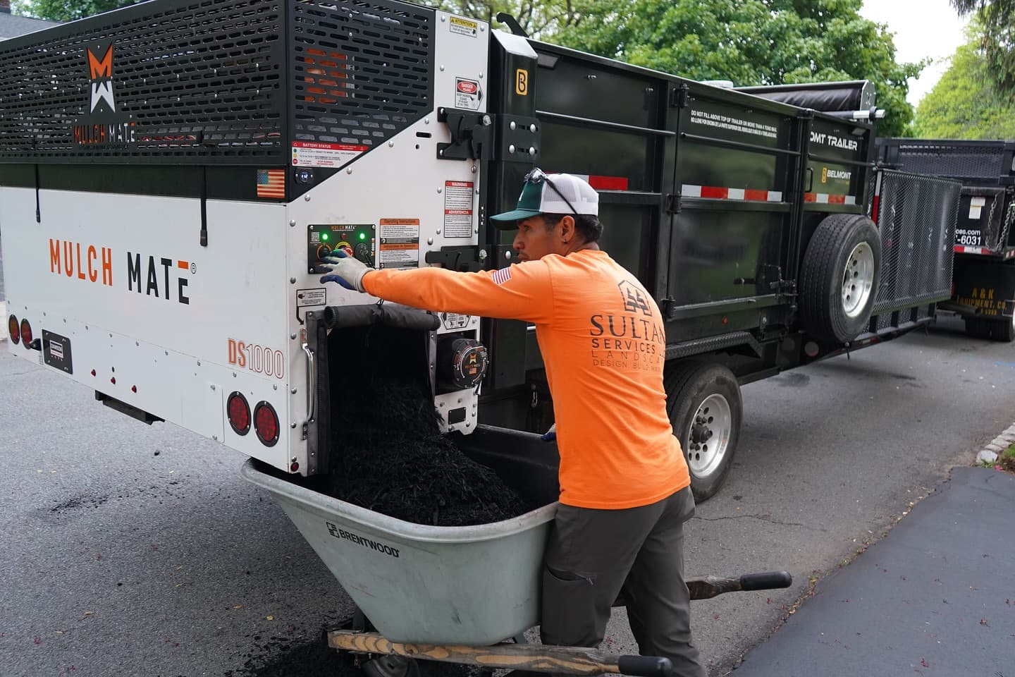 Sultan Services crew using mulch installation equipment