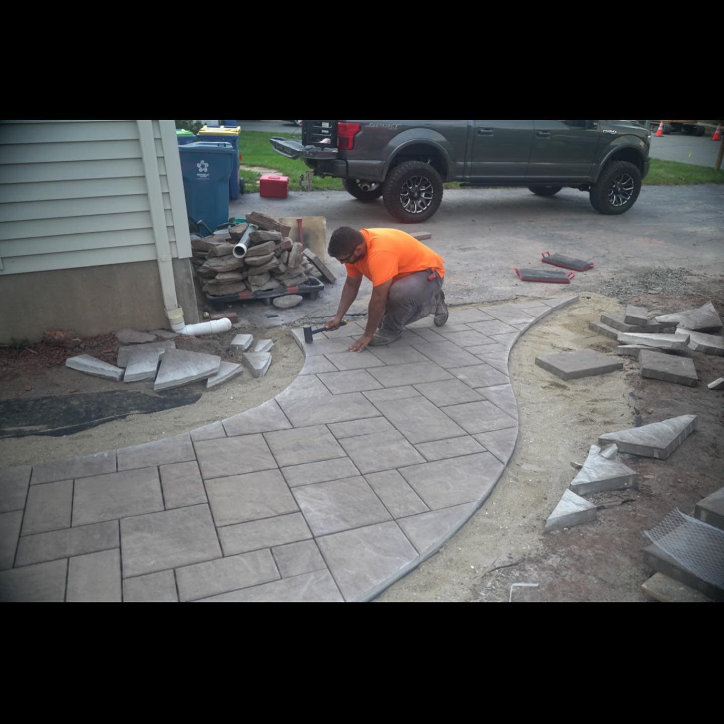 Sultan Services owner installing paver walkway