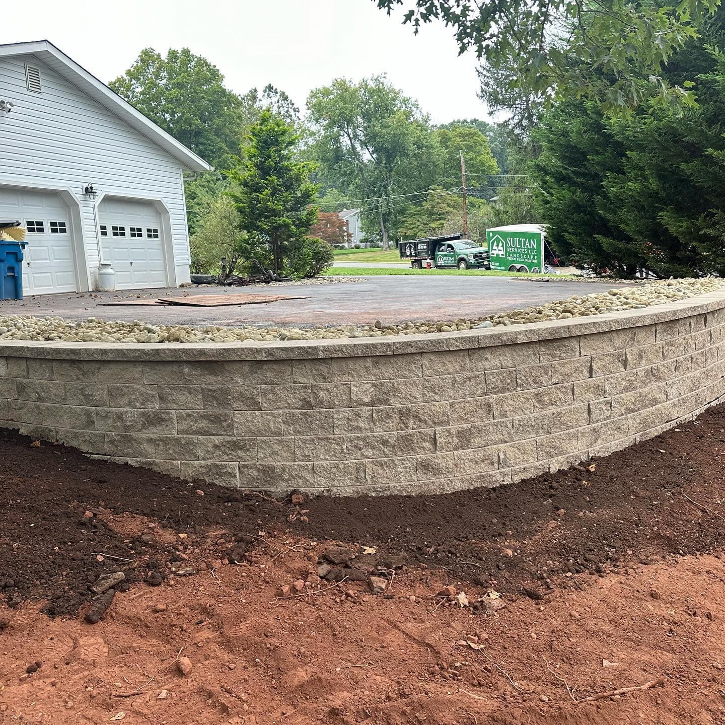 Retaining wall construction with Sultan Services truck on site