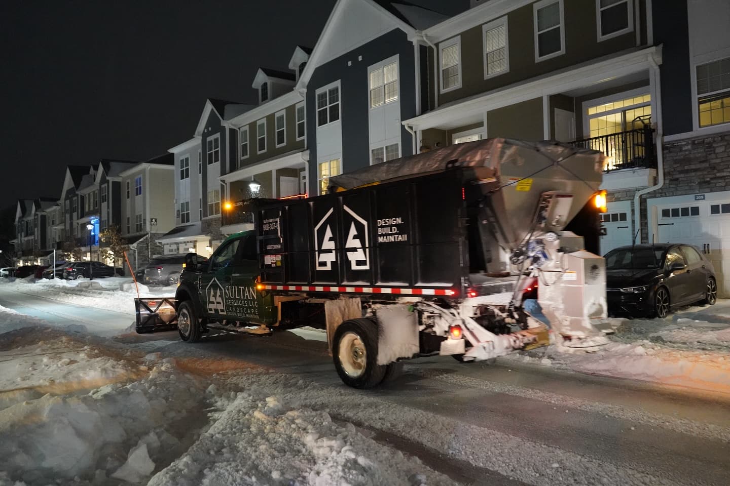 Sultan Services salt spreader truck at townhome community