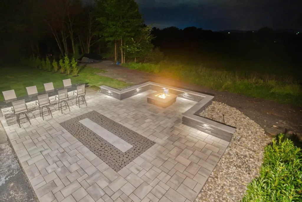 Arial night time view of a fire pit constructed by Sultan Services