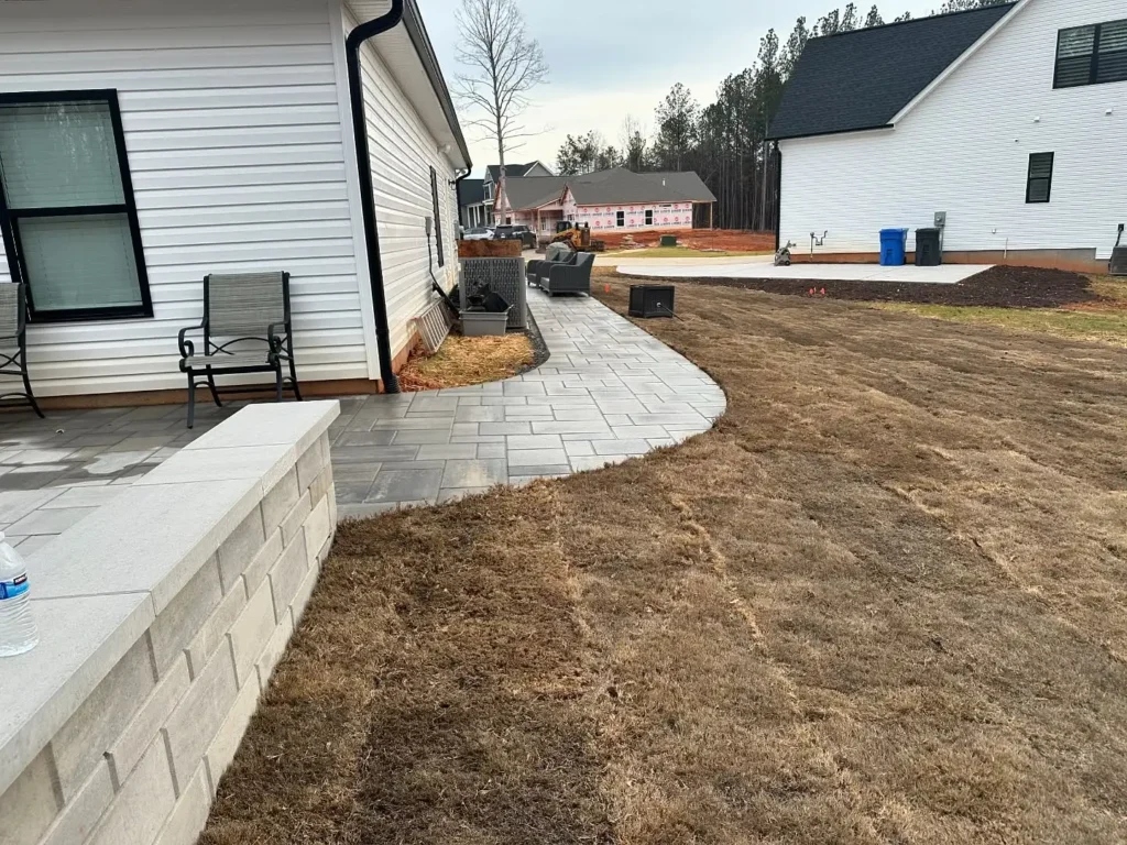 Completed hardscape walkway with patio and wall